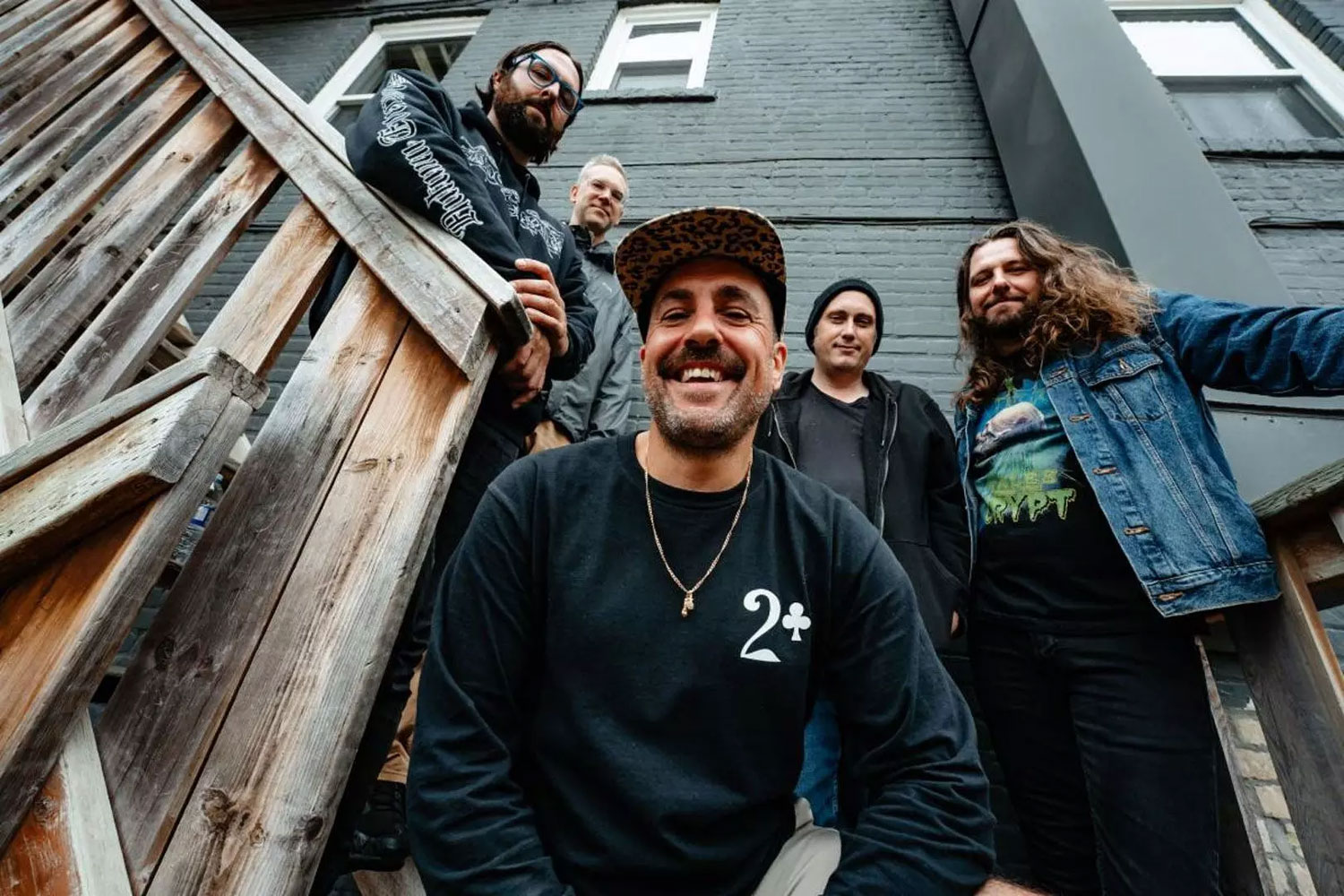 Promotional photo of A Wilhelm Scream posing on outdoor wooden steps